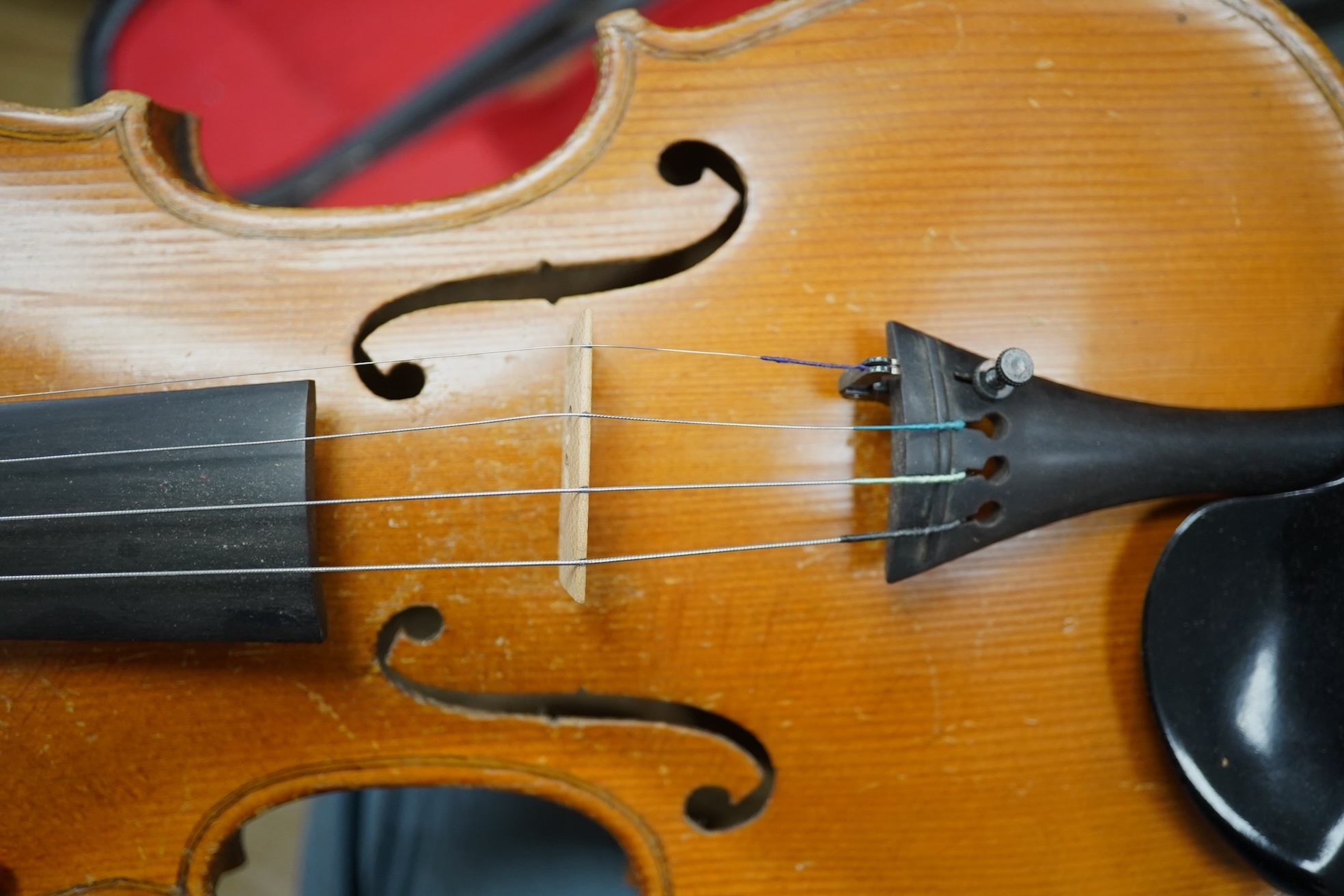 Two cased three quarter size violins, one labelled the London violin Co Ltd, length of back 33.5cm. Condition - both scratched